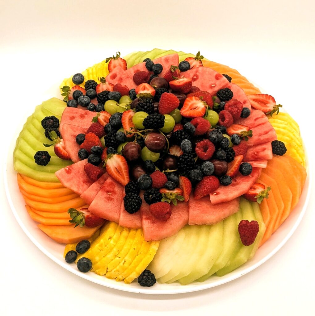 Fresh fruit platter which may include watermelon, canataloupe, honey dew, grapes, strawberries, blackberries, raspberries and blueberries