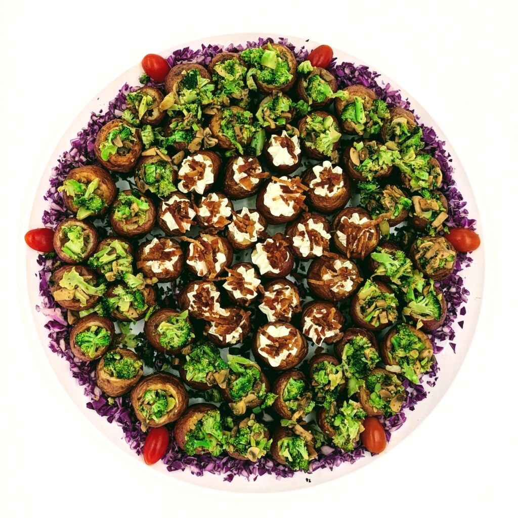 Stuffed potatoes platter with 2 types. # 1 sour cream and bacon. # 2 broccoli and mushroom