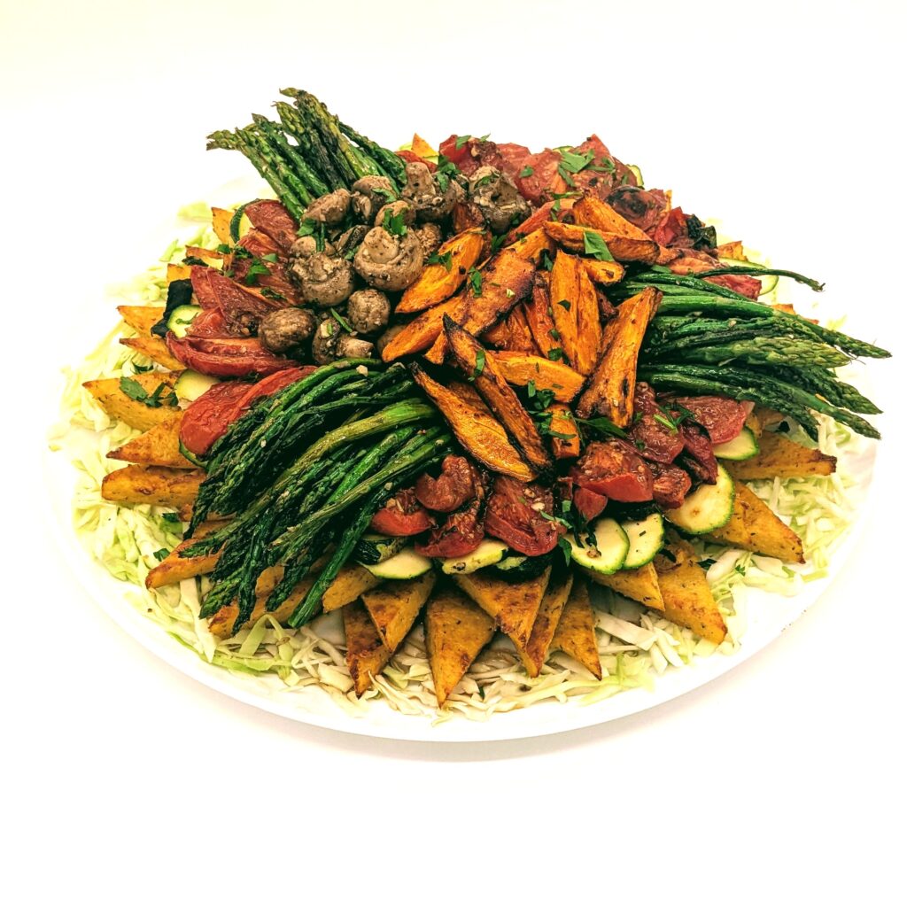 Supreme Vegetable and Polenta platter with grilled zucchini, roasted tomatoes, carrots, mushrooms and asparagus